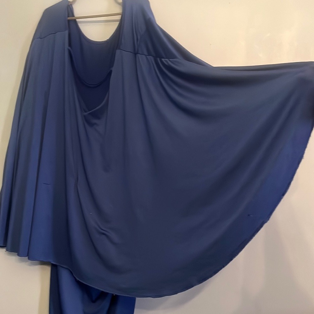 A blue dress one piece that is stretchable that fits to  your body.